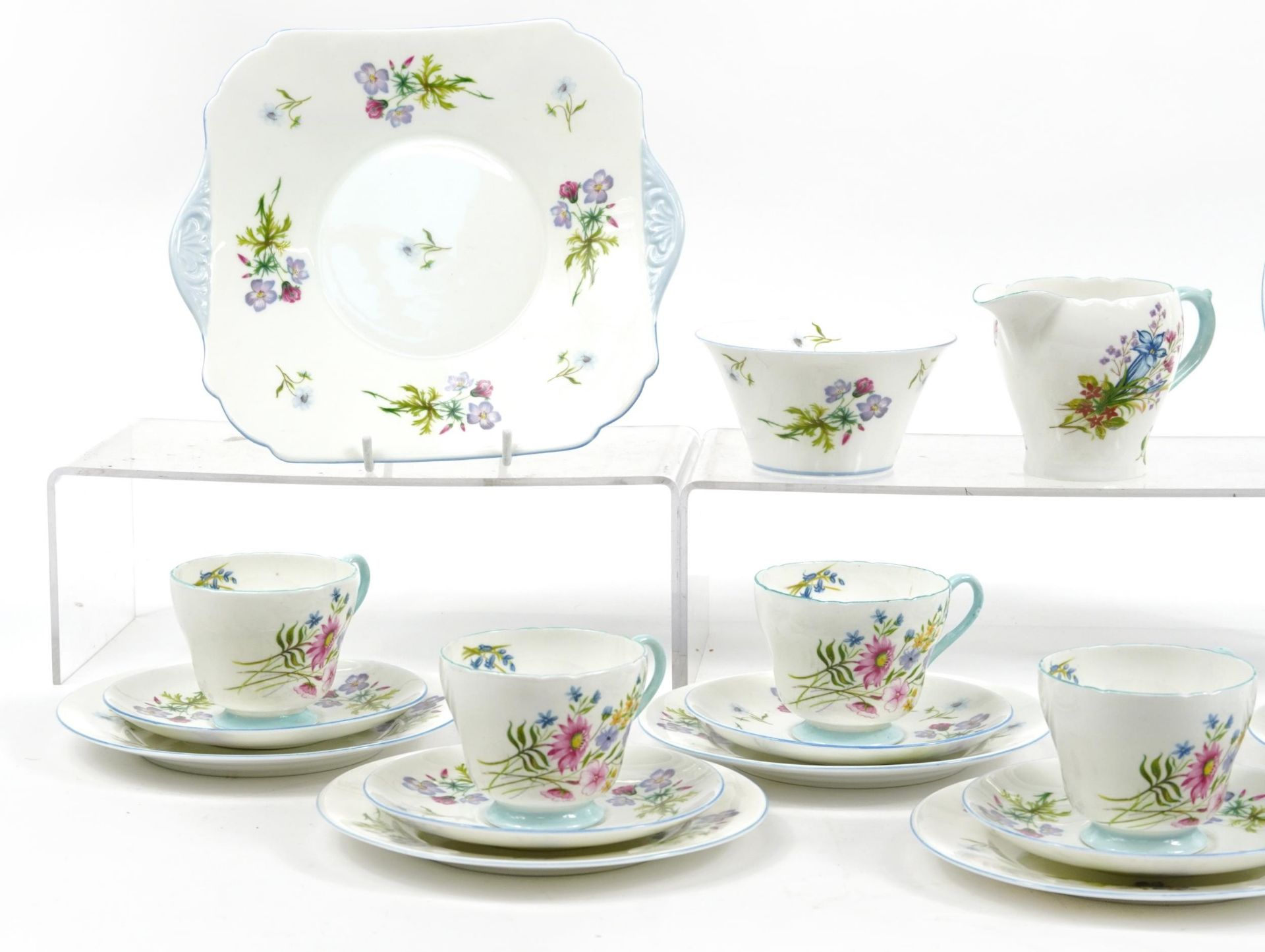 Shelley Wild Flowers teaware comprising six trios, milk jug, sugar bowl and cake plate, the - Image 2 of 4