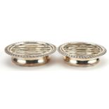 Goldsmiths & Silversmiths Co Ltd, pair of Edwardian circular silver draining stands with grille