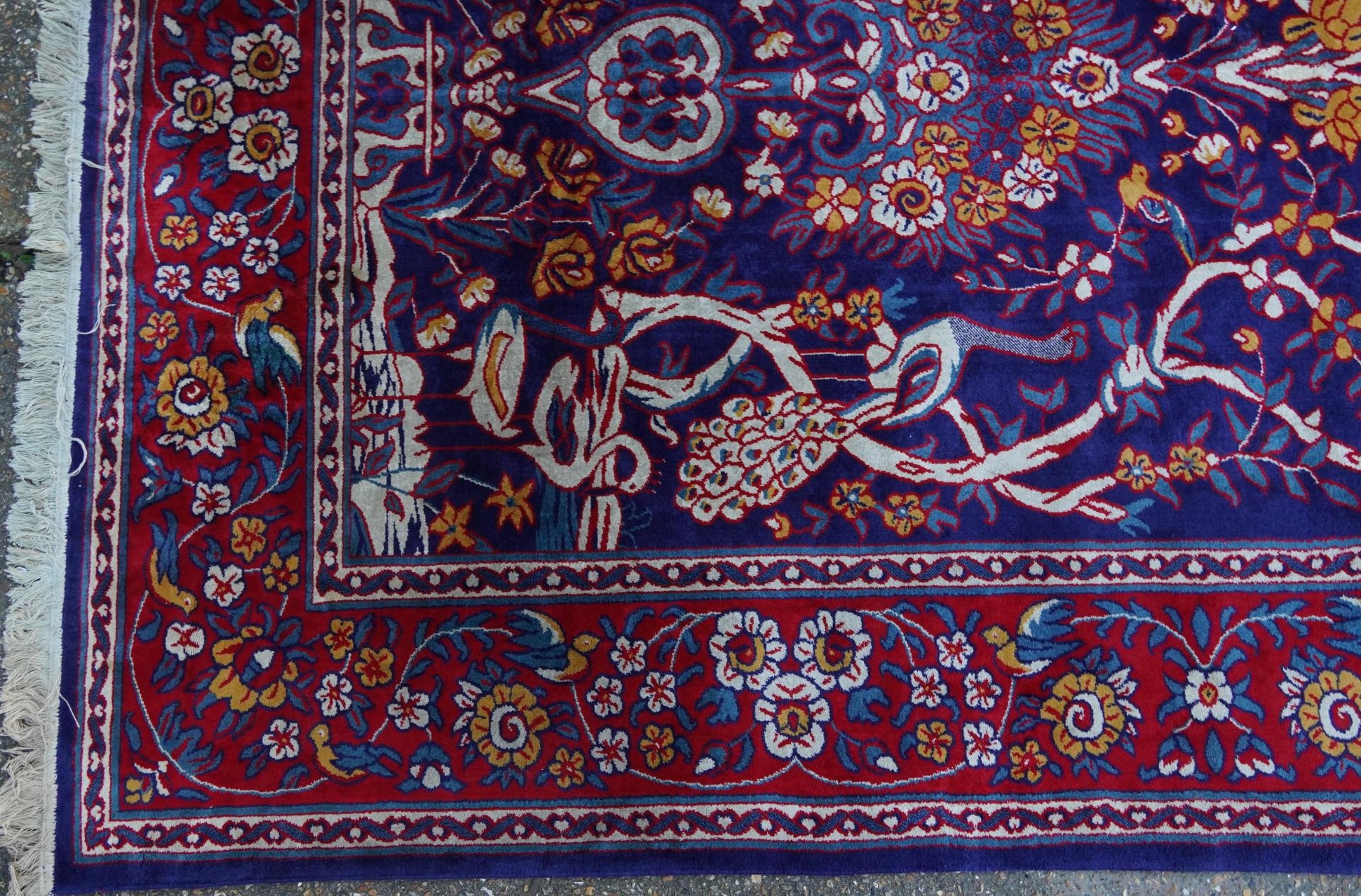 Rectangular Sarook Kashan silk rug decorated with birds amongst flowers onto a predominantly red and - Image 5 of 8