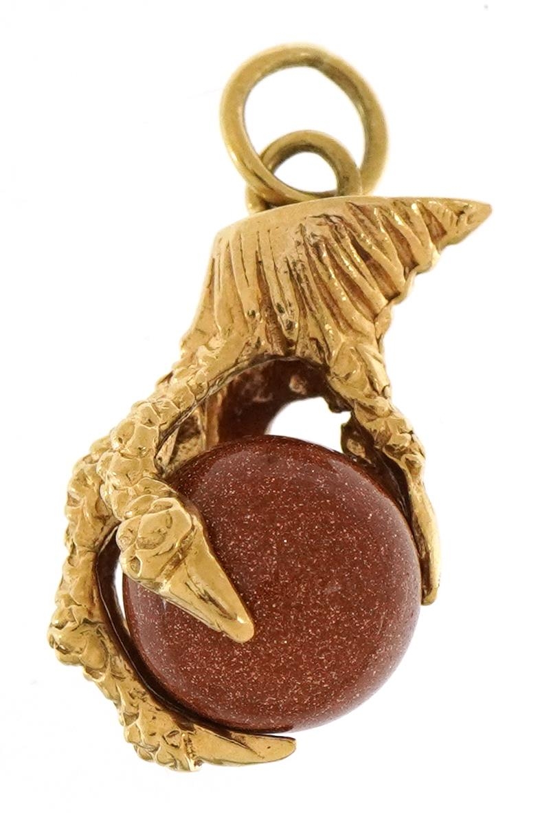 9ct gold goldstone claw and ball charm, 2.1cm high, 4.0g