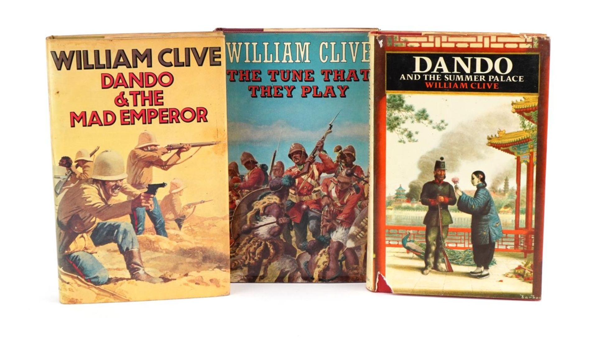 Three signed William Clive hardback books with dust covers comprising Dando and the Mad Emperor, The