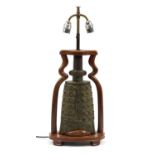 Chinese archaic style patinated metal bell design twin table lamp with hardwood mounts, 39.5cm high