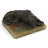 Rectangular green onyx desk paperweight surmounted with a patinated spelter dog, 9cm wide