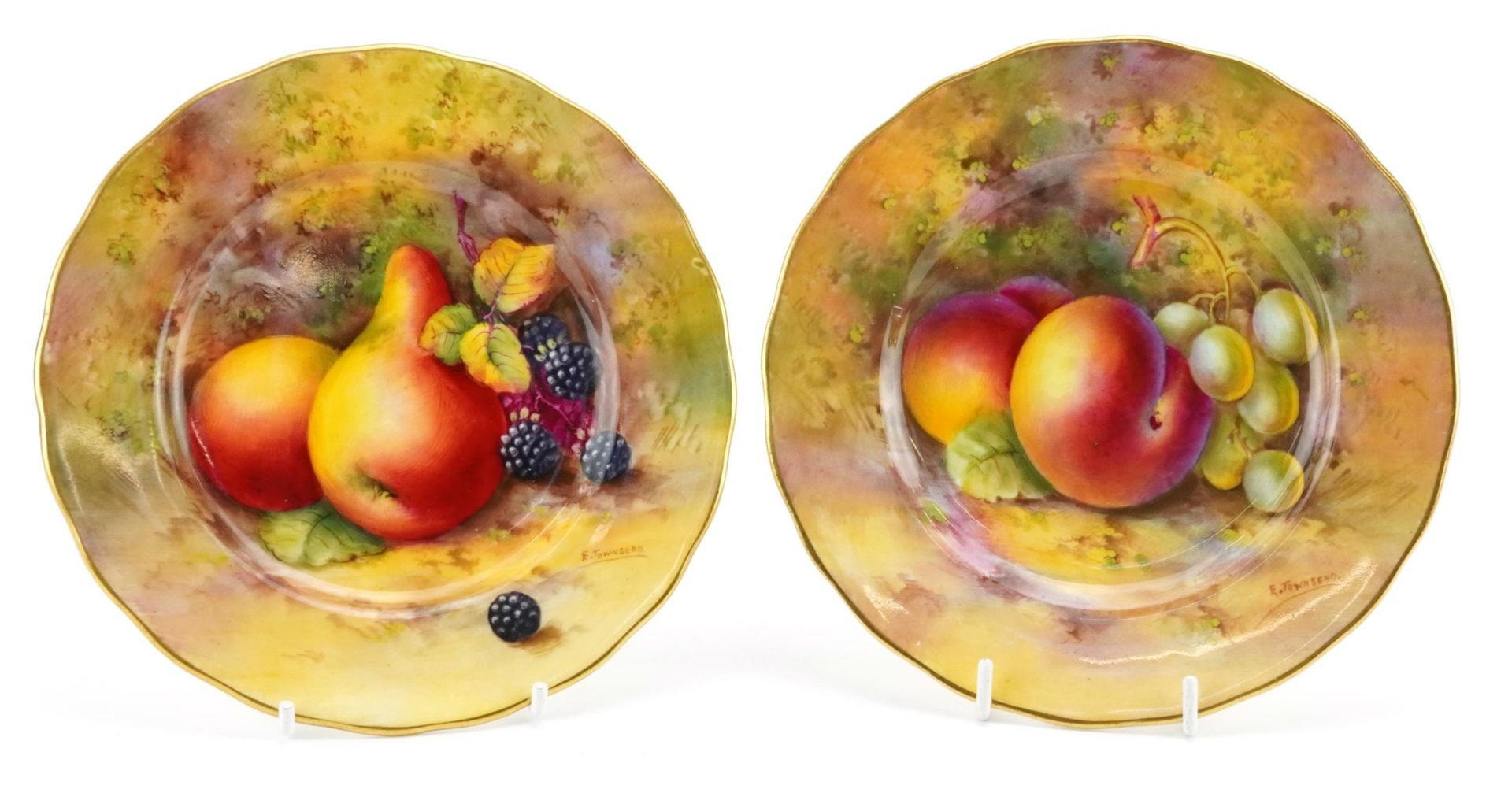Edward Townsend, two Royal Worcester plates hand painted with fruit, each 16.5cm in diameter