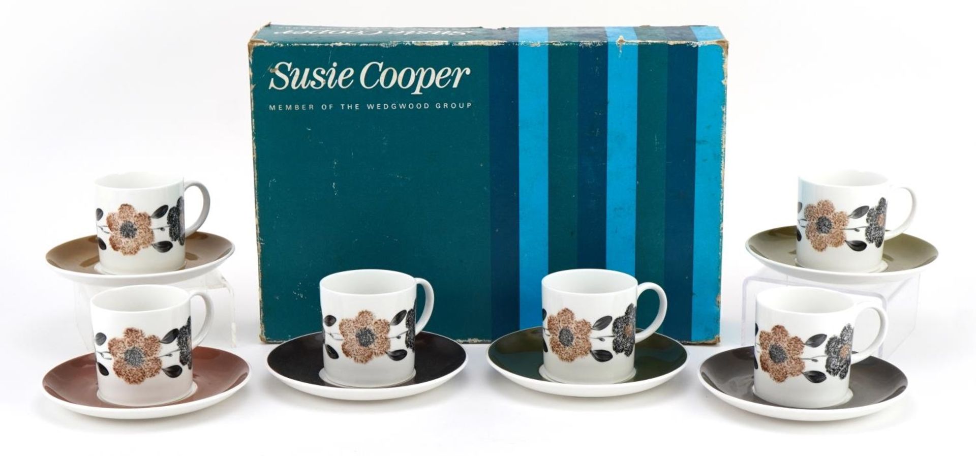 Set of six Susie Cooper coffee cans and saucers decorated with flowers, with box, the saucers 14cm