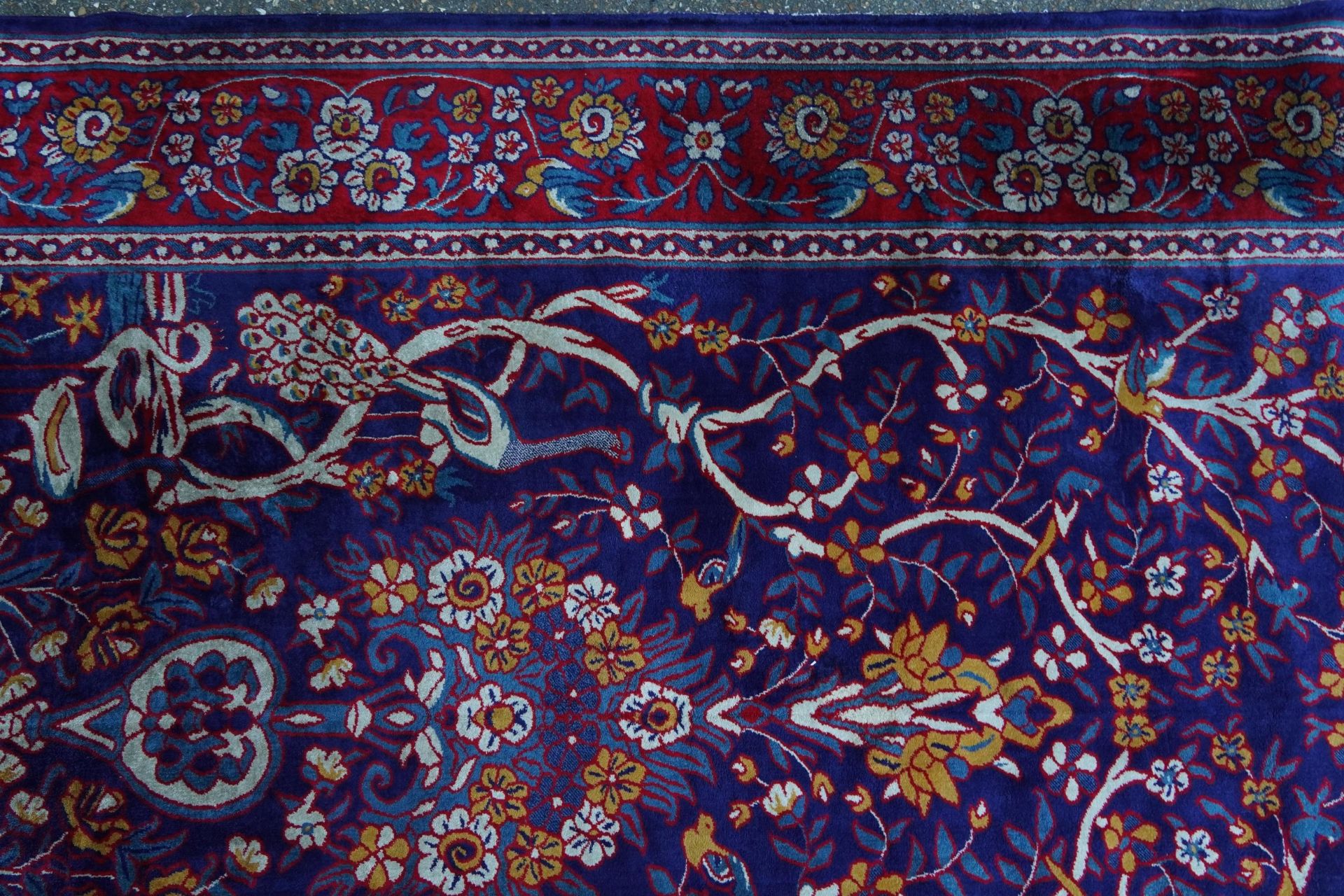 Rectangular Sarook Kashan silk rug decorated with birds amongst flowers onto a predominantly red and - Image 3 of 8