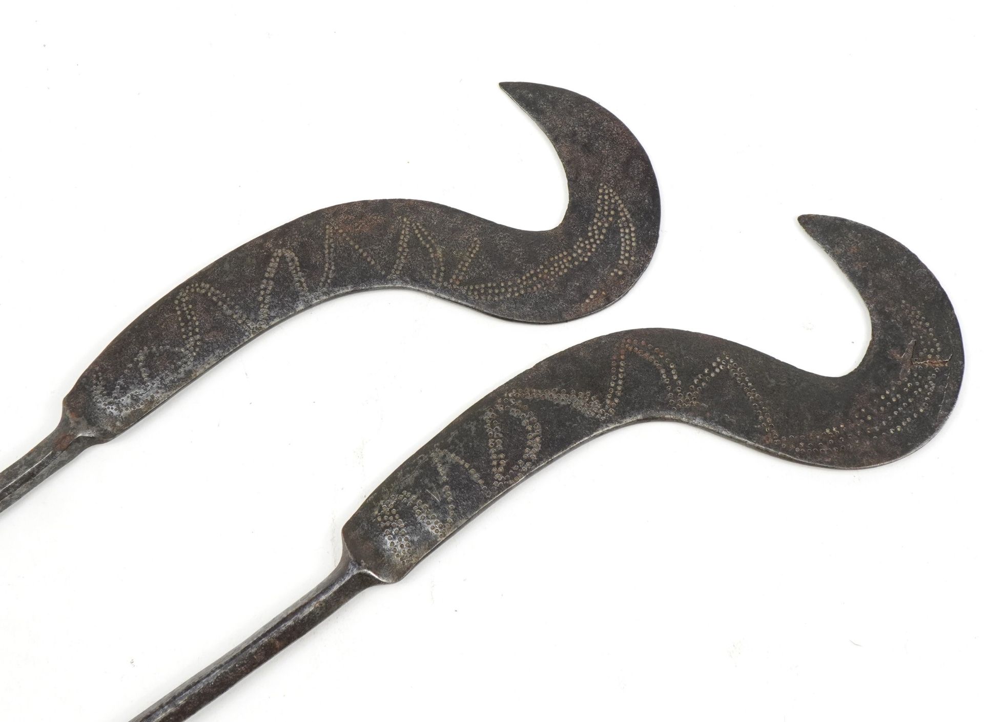 Pair of Asian or African steel banana knives with wooden handles, 49.5cm in length