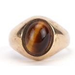 9ct gold cabochon tiger's eye ring, Birmingham 1975, the tiger's eye approximately 9mm x 6.8mm, size