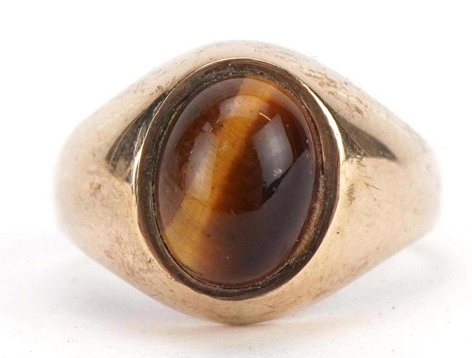 9ct gold cabochon tiger's eye ring, Birmingham 1975, the tiger's eye approximately 9mm x 6.8mm, size