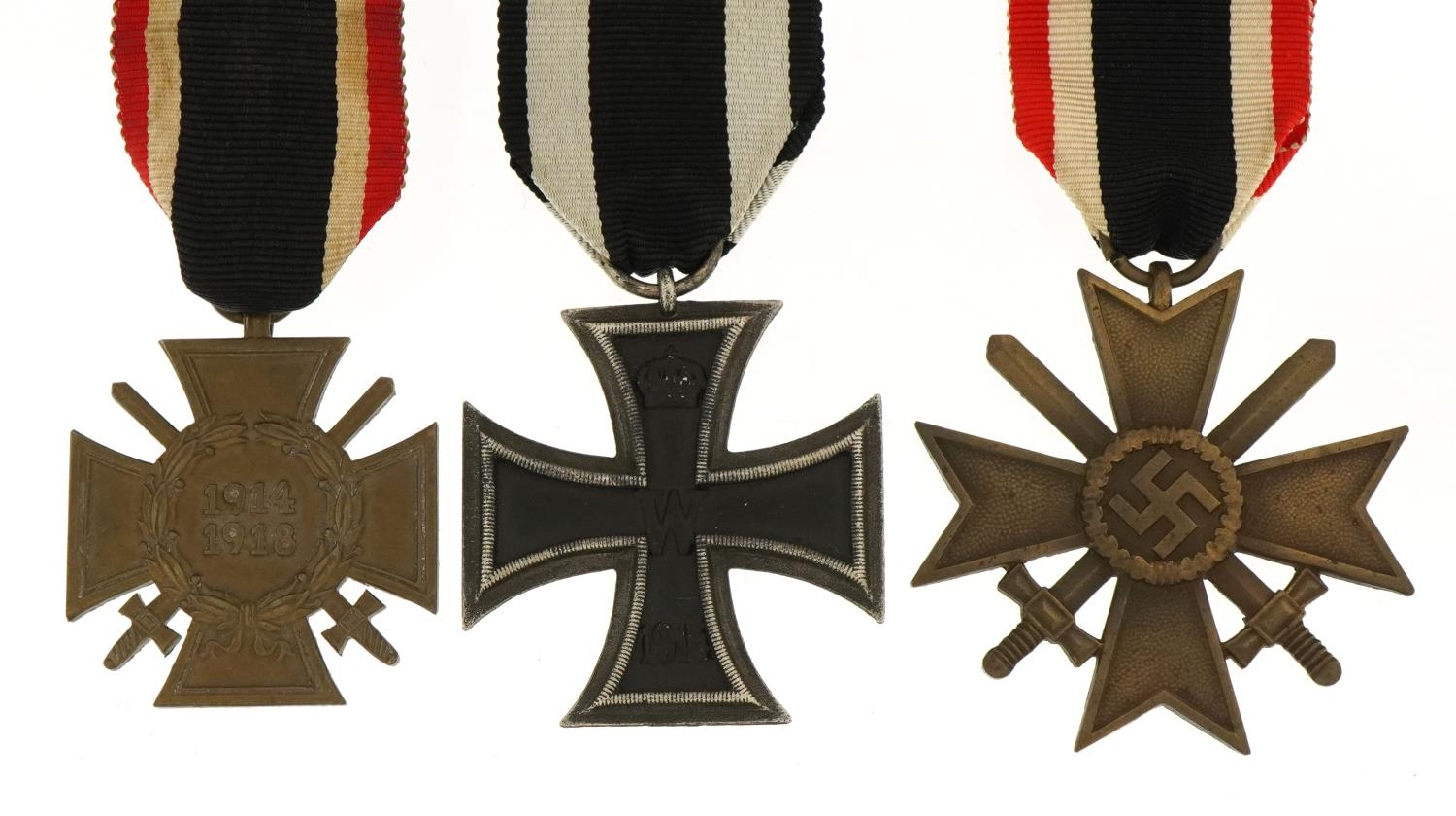Three German military interest medals comprising Iron Cross, Knights Cross and Honour Cross
