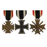 Three German military interest medals comprising Iron Cross, Knights Cross and Honour Cross