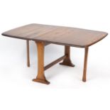 Ercol elm drop leaf coffee table, 45.5cm H x 68.5cm D x 17cm W extending to 104cm W