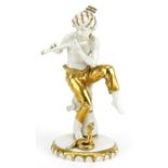 Sitzendorf, German partially gilt porcelain figure of a snake charmer, 21.5cm high