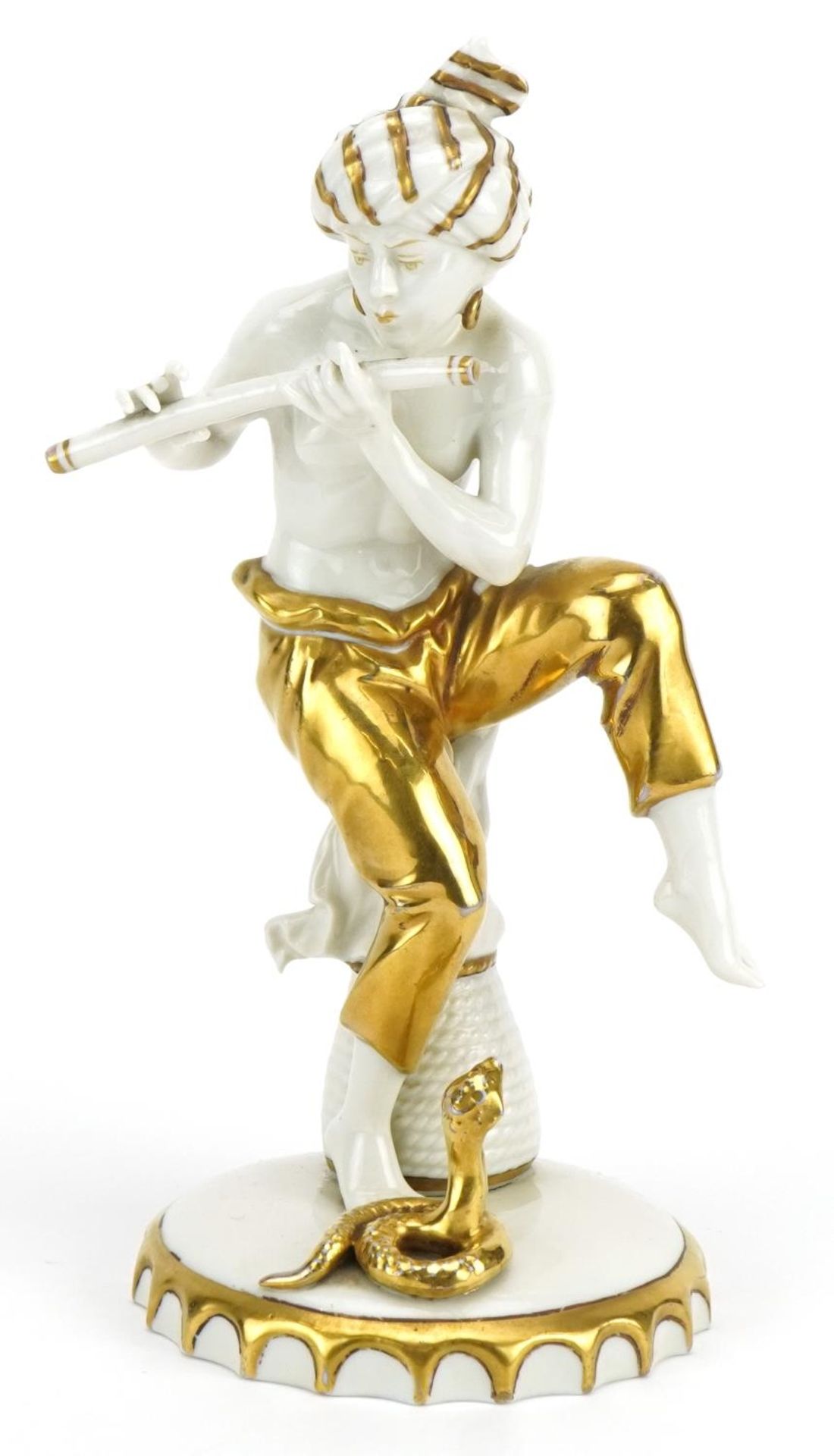 Sitzendorf, German partially gilt porcelain figure of a snake charmer, 21.5cm high