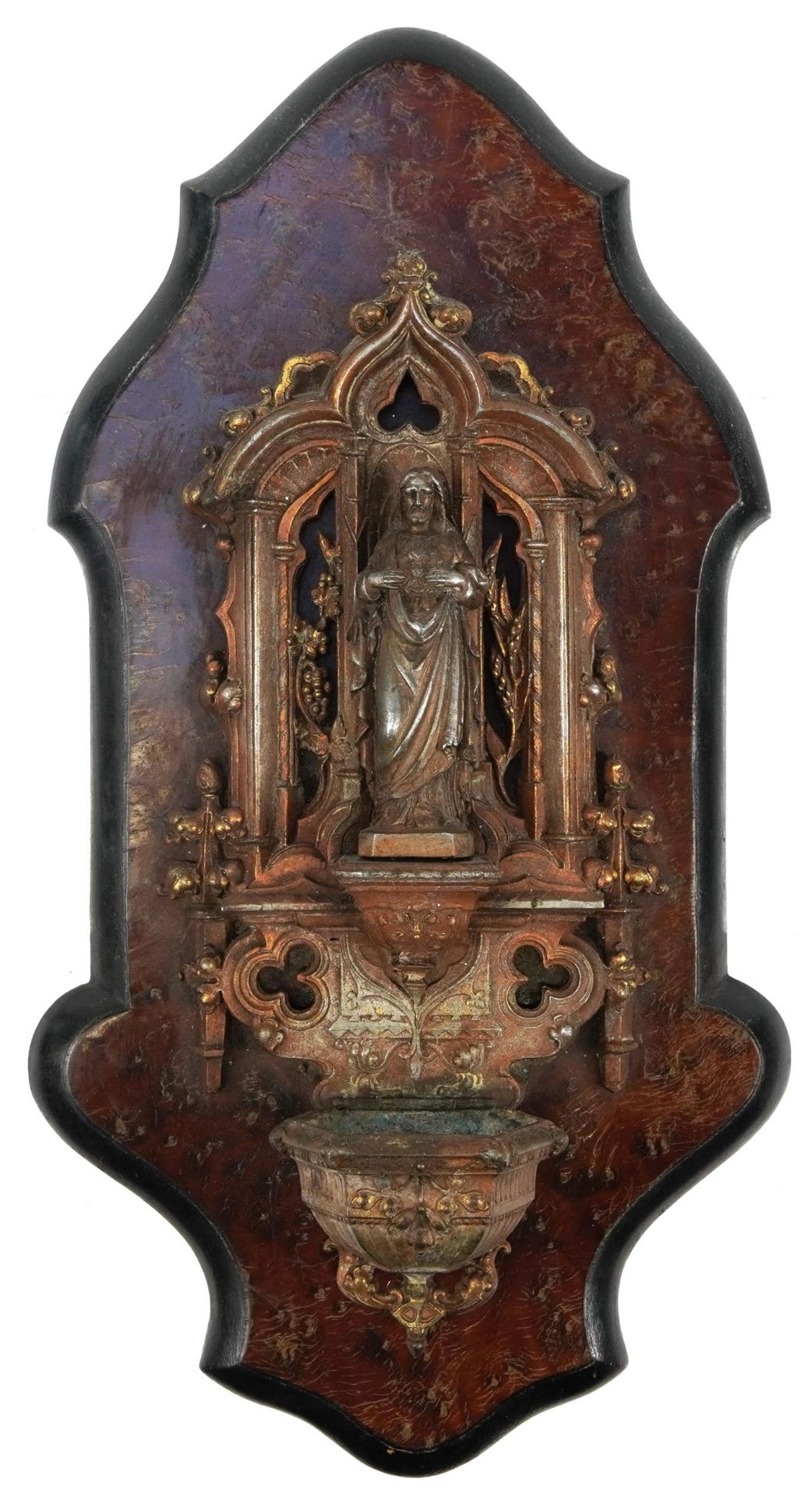 19th century patinated spelter holy water font with ebonised and burr wood back, 39cm high