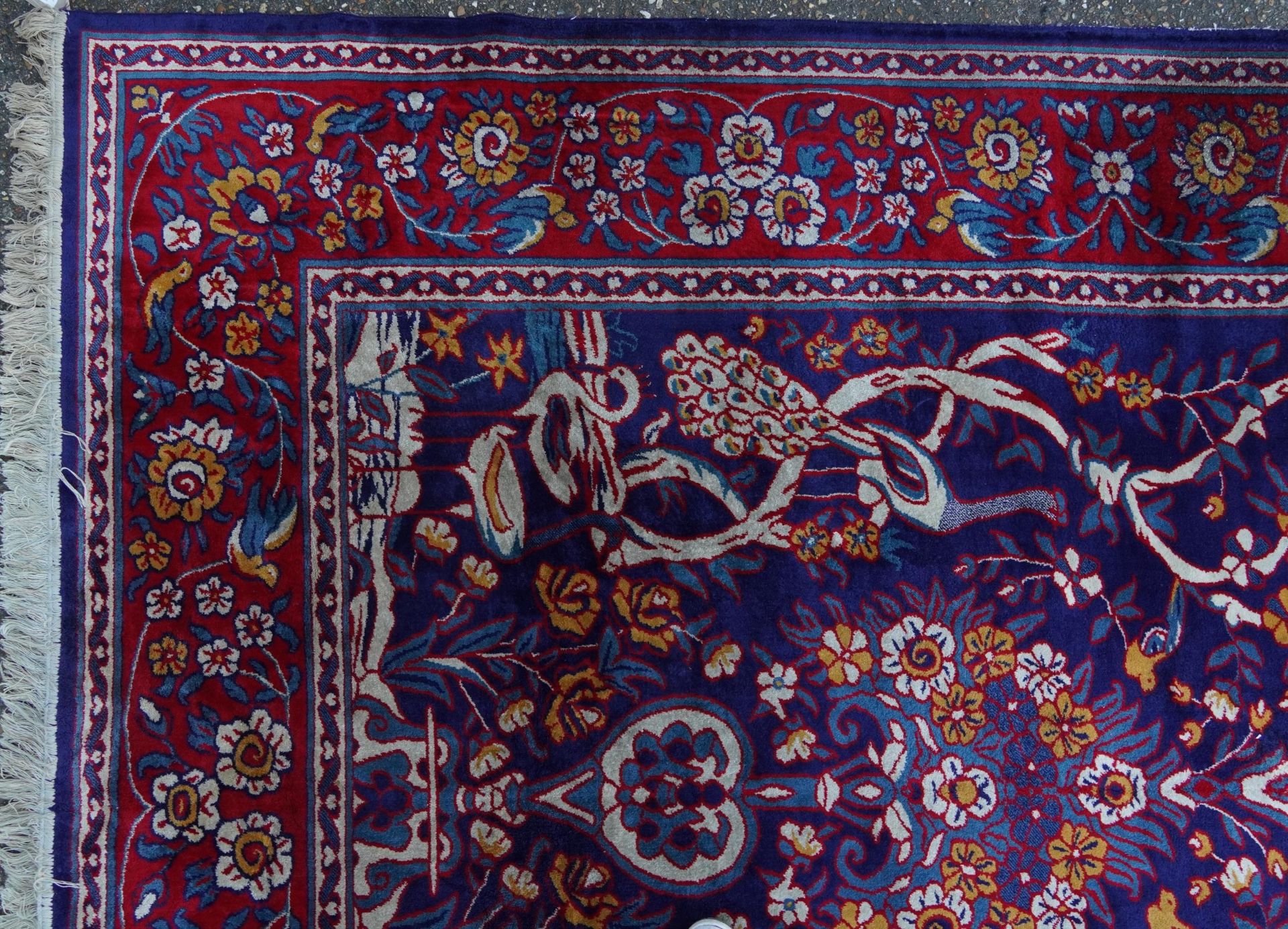 Rectangular Sarook Kashan silk rug decorated with birds amongst flowers onto a predominantly red and - Image 2 of 8