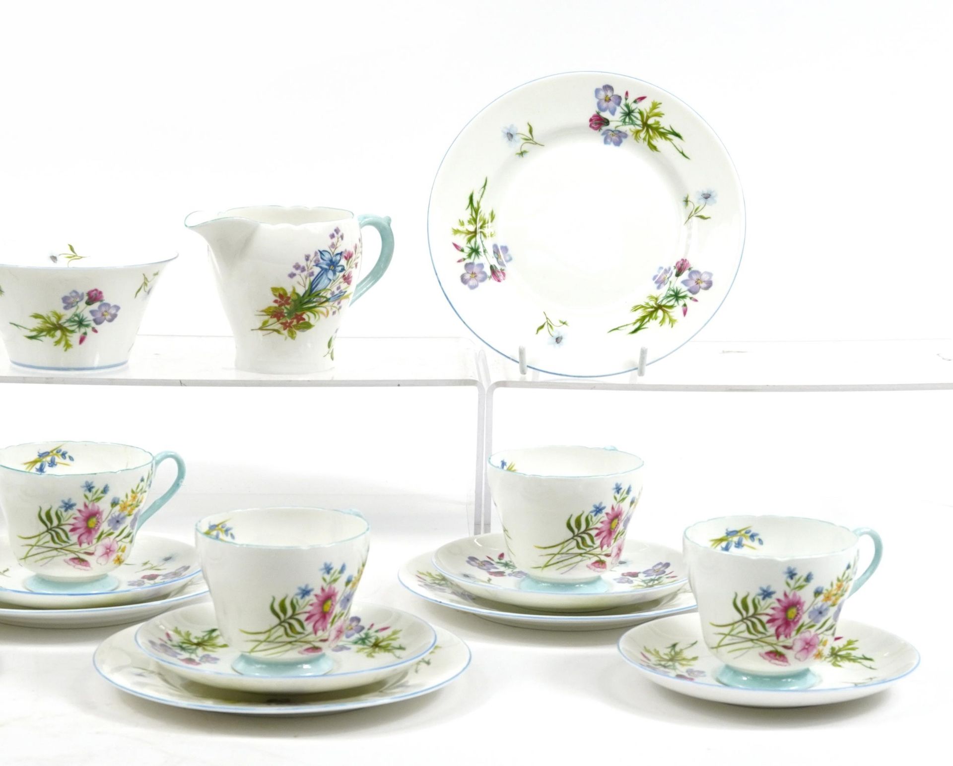 Shelley Wild Flowers teaware comprising six trios, milk jug, sugar bowl and cake plate, the - Image 3 of 4