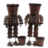 Pair of bronzed tin flower pot men planters