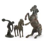 Two patinated bronze horses and a bronze study of Discobolus, the largest 21.5cm in length