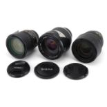 Three camera lenses comprising Sigma 28-300mm, Nikon 18-70mm and Nikon 18-135mm