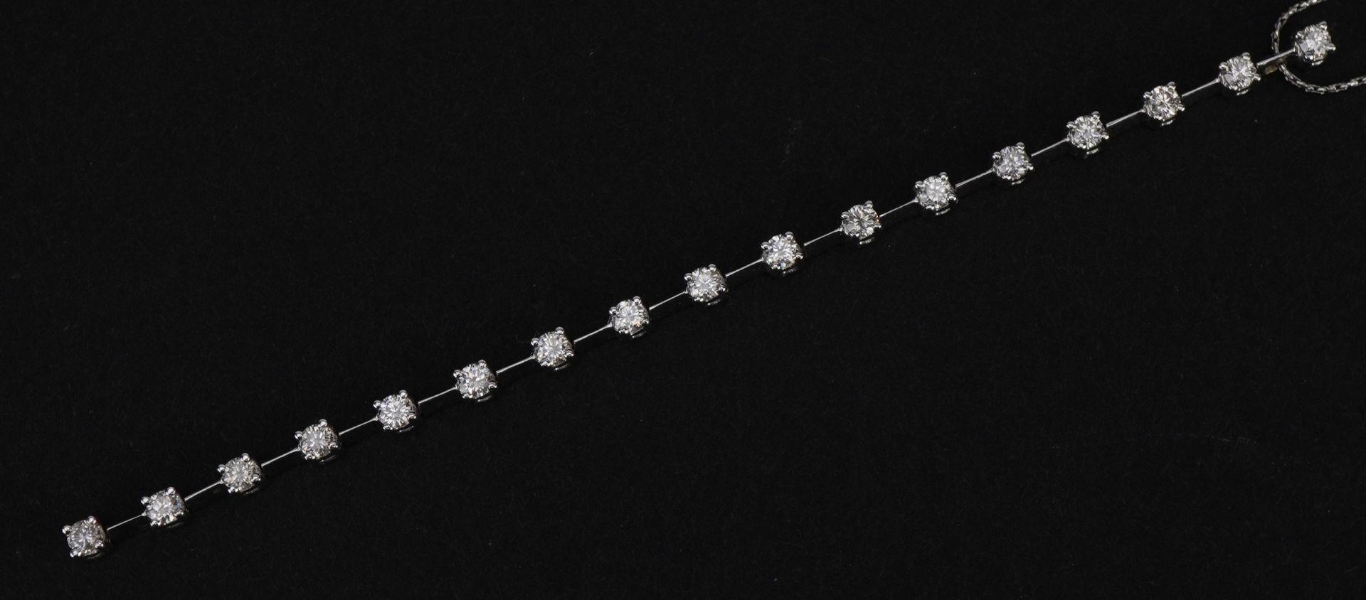 18ct white gold diamond line pendant set with seventeen diamonds on a 18ct white gold necklace,