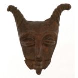 African patinated bronze mask, 5cm high