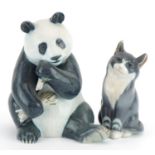 Royal Copenhagen, Danish porcelain seated panda and cat, the largest 17.5cm high For further