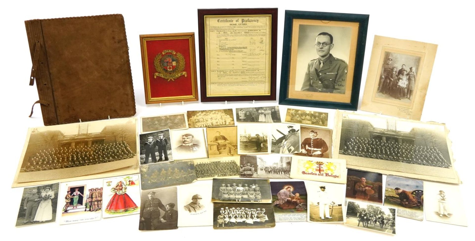 Military interest ephemera including photographs arranged in an album, real photographic