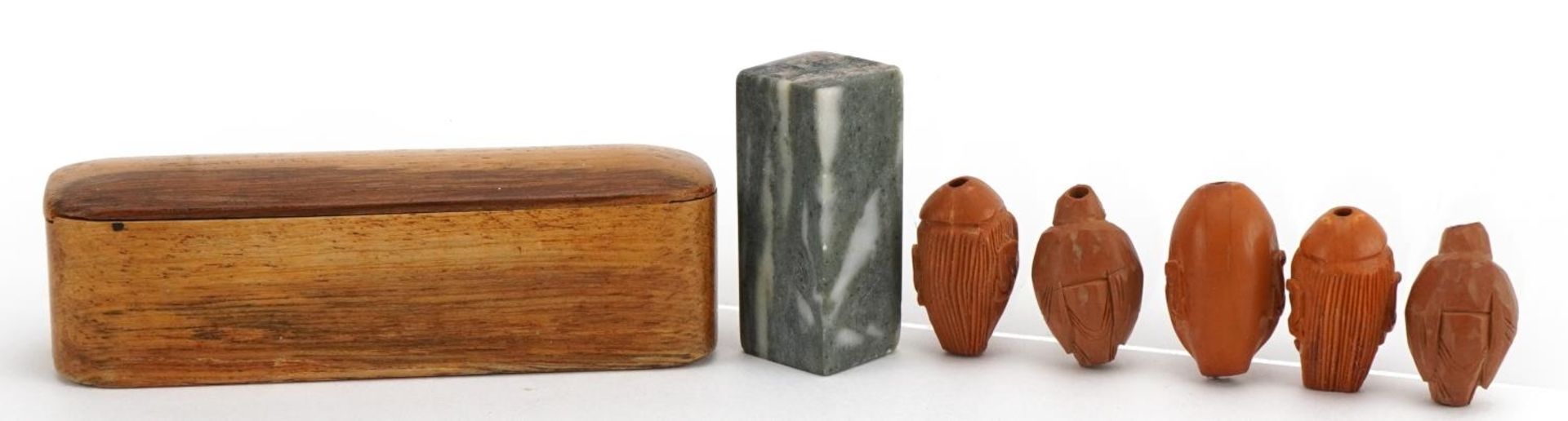 Five Chinese carved coquilla nuts and a hardstone desk seal with calligraphy, with hardwood case - Image 4 of 5