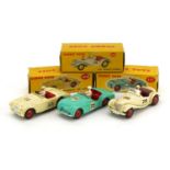 Three Dinky Toys diecast racing vehicles with boxes comprising MG Midget Sports 108, Austin Healey