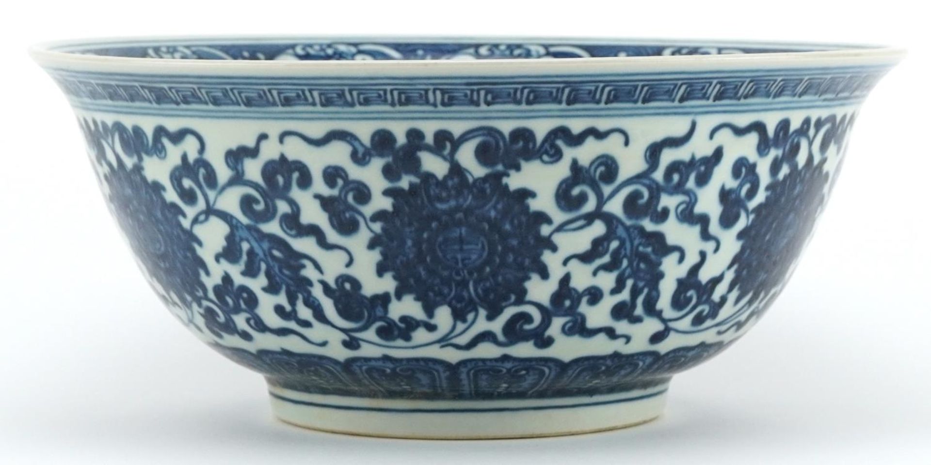 Chinese Islamic blue and white porcelain bowl hand painted with flower heads amongst scrolling