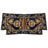 Chinese blue ground fireplace rug decorated with Daoist emblems and flowers, 120cm x 53cm For