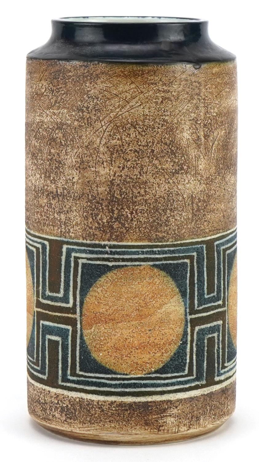 Troika St Ives pottery cylindrical vase hand painted with discs within a stylised geometric band,