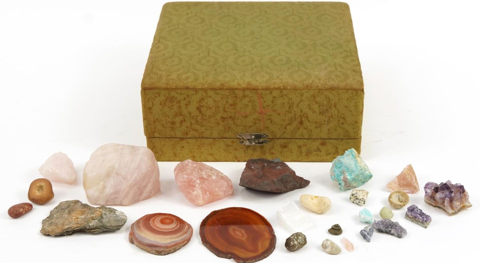 Collection of rock minerals and specimens including agate, rose quartz and amethyst, the largest