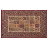 Rectangular Persian rug, the central field having a repeat tree design, the red ground borders