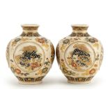 Pair of Japanese Satsuma pottery vases finely gilded with panels of dragons and flowers, character