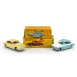 Two Dinky Toys diecast vehicles with boxes comprising Jaguar 3.4 Saloon 195 and Triumph Herald 189