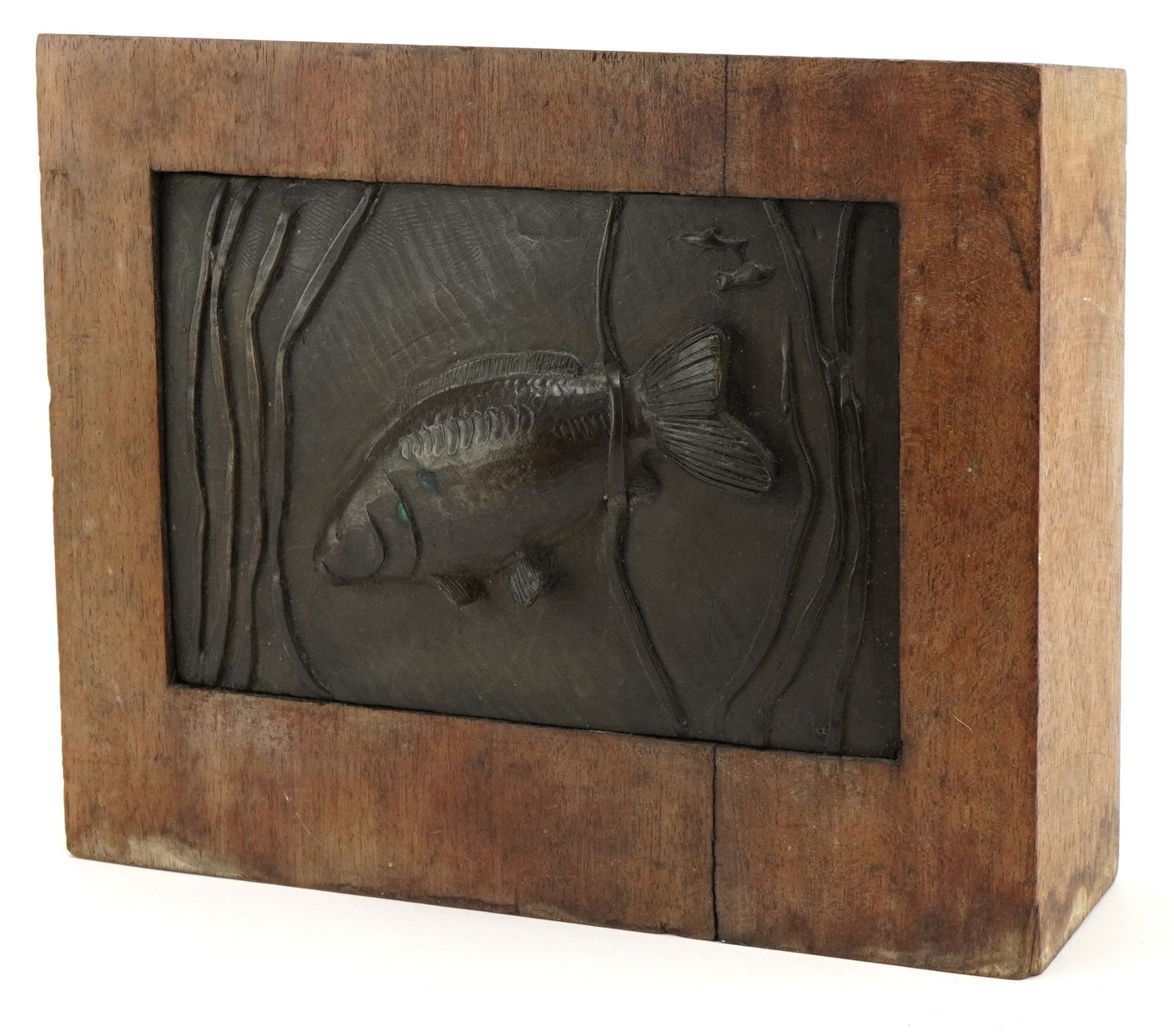 Mid century style wooden block inset with a bronzed plaque of a fish amongst aquatic life, 22cm H