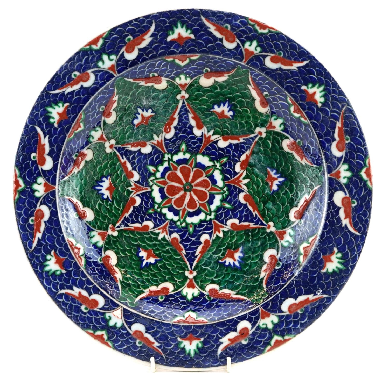 Turkish Ottoman Iznik shallow charger hand painted with stylised flowers, 36cm in diameter For