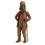 19th century Bavarian carved wood figure of a bearded man holding a staff, 29cm high For further