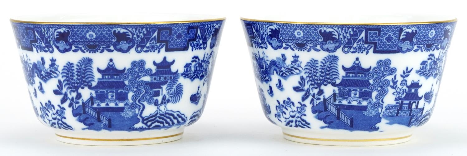 Two Royal Worcester porcelain bowls decorated in the chinoiserie manner, 15cm in diameter For
