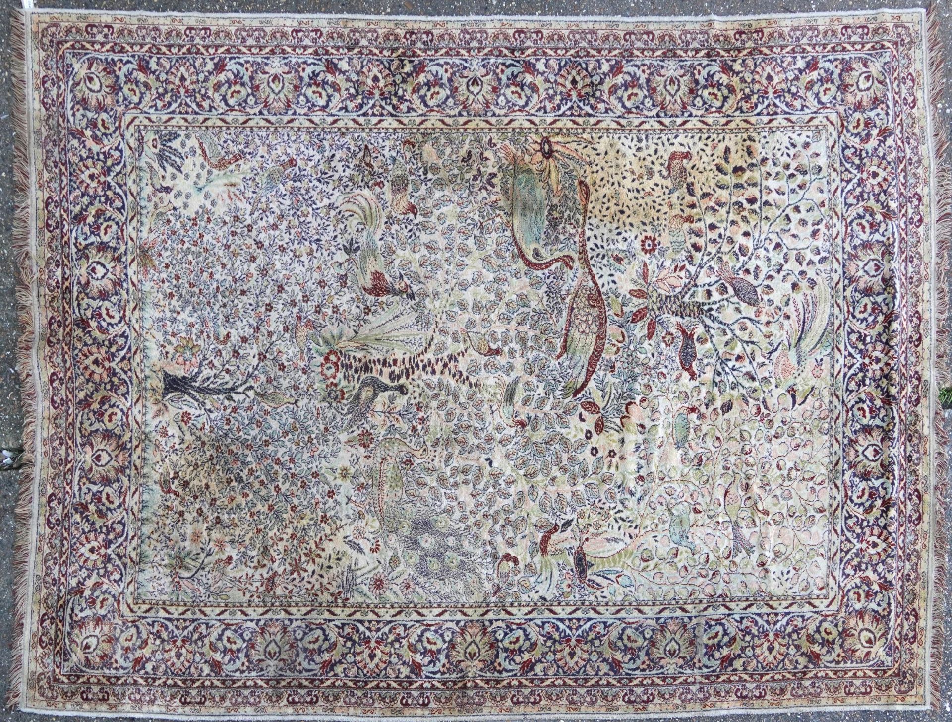 Rectangular Persian carpet, the central field decorated with birds of paradise amongst flowers