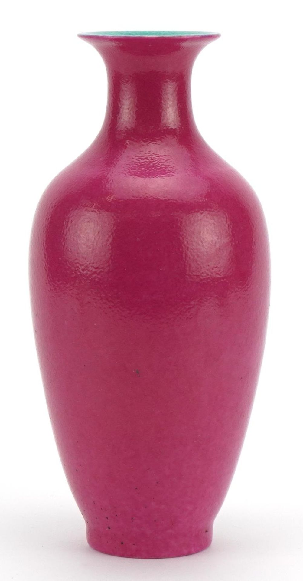 Chinese porcelain vase having a pink glaze, four figure iron red character marks to the base, 23.5cm