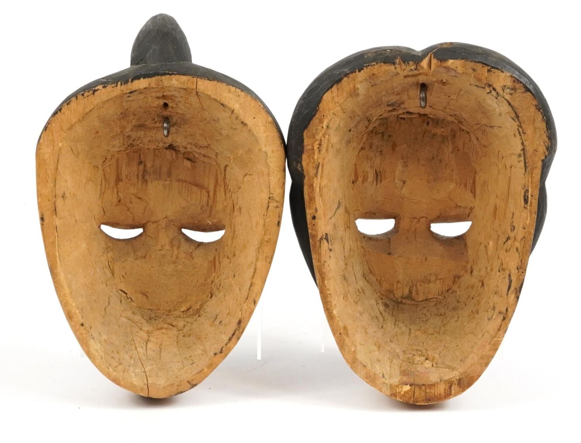 Two early 20th century African tribal interest carved wood face masks from Nigeria, the largest 29cm - Bild 2 aus 2