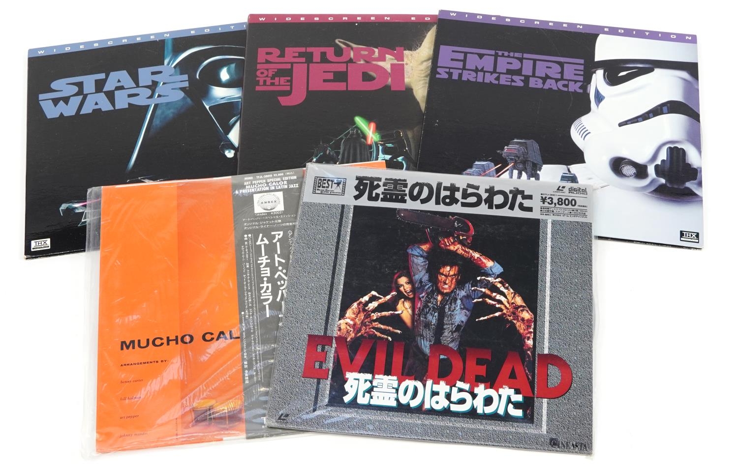 Three Star Wars laser discs and two Japanese examples comprising Evil Dead and Mucho Calor For