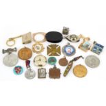 Sundry items including commemorative medallions, compass pendant and military lighter For further