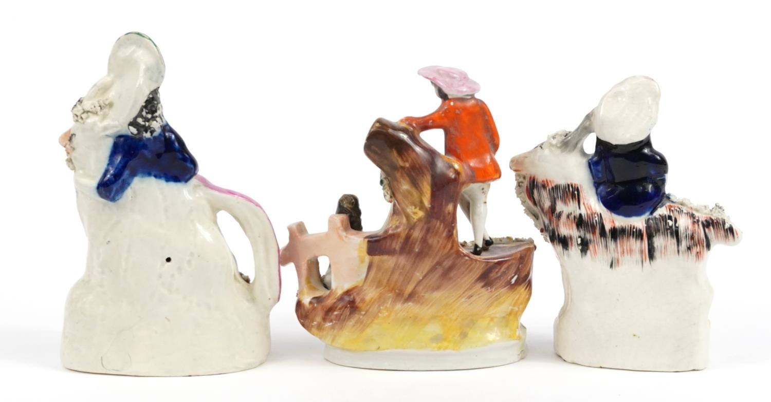 Three Victorian Staffordshire figures including a courting couple and figure on horseback, the - Image 2 of 3