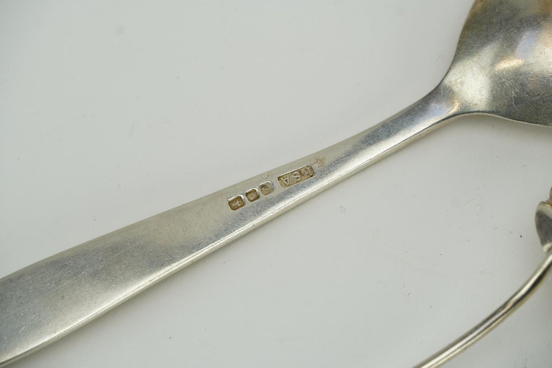 Five silver spoons and a pair of silver sugar tongs, three with shell shaped bowls, the largest 19cm - Image 3 of 3