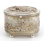 French silver plated copper four footed jewel casket decorated in relief with huntsmen, impressed