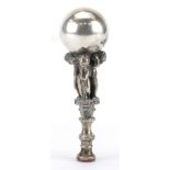 Victorian silver plated desk seal in the form of three cherubs holding a ball aloft, 12cm high For